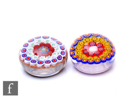 A contemporary Jim Hart glass paperweight of domed form, internally decorated with a central large pink Clichy style rose, su