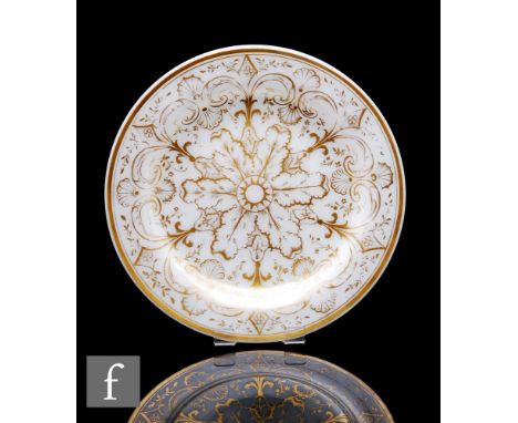 A 19th Century Richardsons glass plate, the shallow opal plate of circular section with a wide flat rim, hand gilded to the w