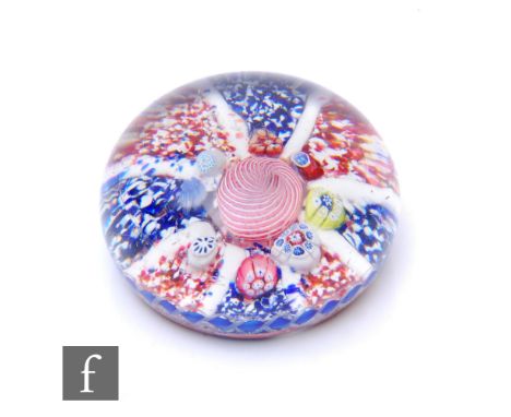 A 19th Century St Louis glass paperweight circa 1850s, of domed form, internally decorated with a central pink and white spir