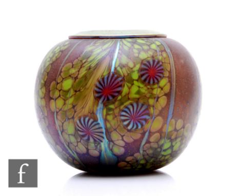 A contemporary Okra studio glass vase, designed by Richard Golding, of globe form, with gilded metal rim, decorated with styl