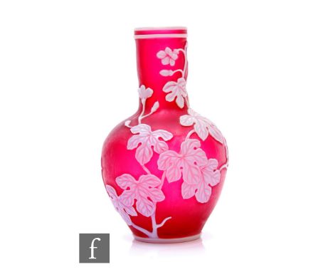 A late 19th Century Stourbridge cameo glass vase, possibly Stevens &amp; Williams, of baluster form, opal over ruby, cut with
