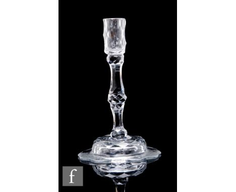 An 18th Century taper stick circa 1775, the slender slice cut sconce above a facet cut stem with medial knop, raised to a dom