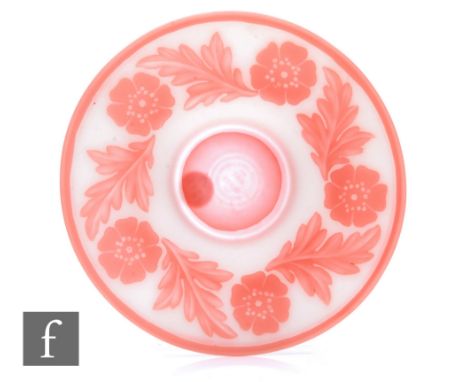 A Stevens and Williams cameo glass saucer of circular form, peach over opal, cut with flower heads and leaves within peach ba