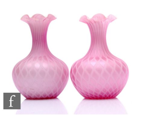 A pair of late 19th Century cased iridescent pink airtrap vases, of gourd form with drawn neck and crimped rim, quilted pink 
