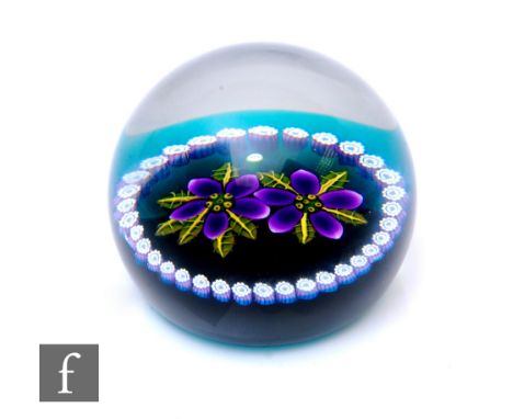 A 20th Century William Manson for Caithness glass paperweight, in the Primroses (style 2) pattern, of domed form, internally 
