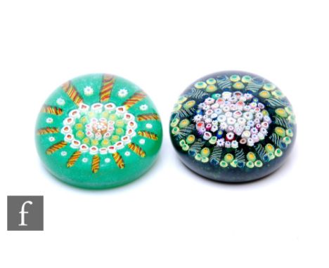 A contemporary William Manson and Joyce Manson glass paperweight of domed form, internally decorated with a central complex c