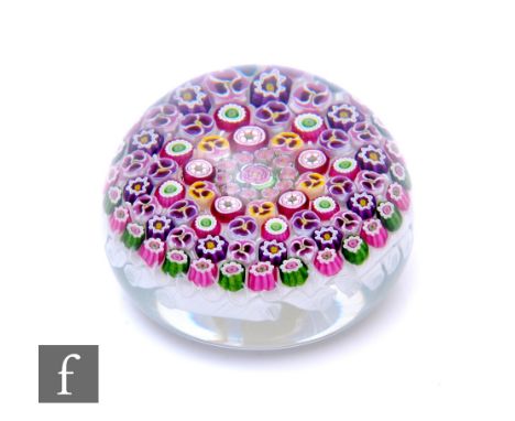 A later 20th Century Parabelle Glass paperweight of domed form, internally decorated with multiple Clichy style rose and pans