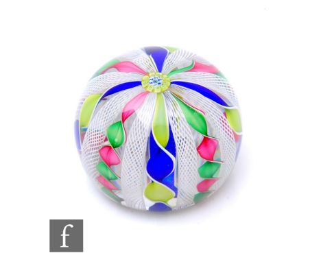 A later 20th Century St Louis glass paperweight of high domed form, internally decorated with a central complex dated cane fo