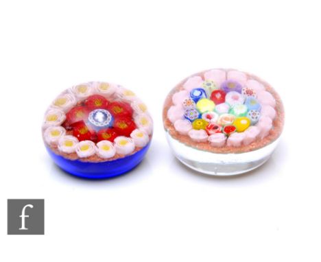 A Jim Hart glass paperweight of domed form, internally decorated with a cluster of complex multicoloured millefiori and Clich