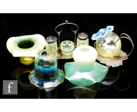 A collection of late 19th and early 20th Century straw opal glassware, to include a three piece cruet in plated stand, decora