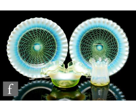 A pair of late 19th Century Stourbridge straw opal bowls, of circular shallow form with crimped rims, with radiating spiral o