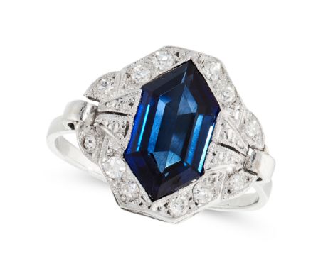 AN ART DECO SAPPHIRE AND DIAMOND DRESS RING set with a hexagonal step cut blue sapphire of 2.06 carats, accented by single cu