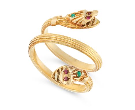 AN ANTIQUE JADE AND RUBY SNAKE RING in yellow gold, designed as two snakes coiled around on themselves, their heads set with 