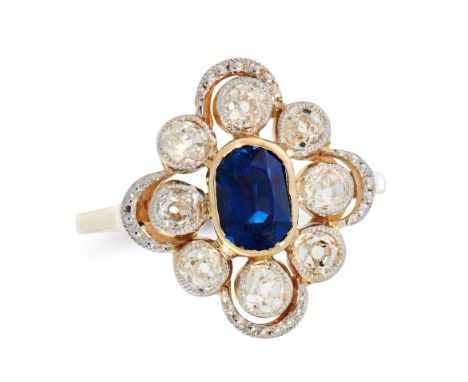 A SAPPHIRE AND DIAMOND DRESS RING, EARLY 20TH CENTURY in 18ct yellow gold and platinum, set with a cushion cut sapphire of 0.