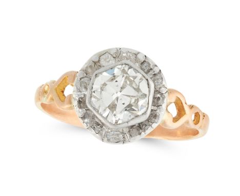 AN ANTIQUE SOLITAIRE DIAMOND DRESS RING in yellow gold and silver, set with an old cut diamond of 1.11 carats within a border