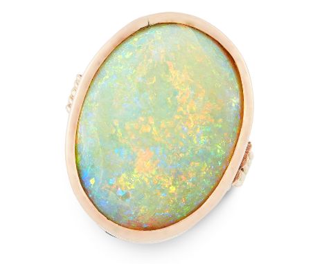 AN OPAL DRESS RING in 14ct yellow gold, set with an oval cabochon opal of 13.53 carats, stamped 585, size P / 7.5, 8.1g.