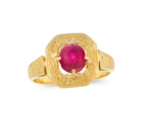 A BURMA NO HEAT RUBY DRESS RING in high carat yellow gold, set with an oval cabochon ruby of 1.6 carats, within an engraved b