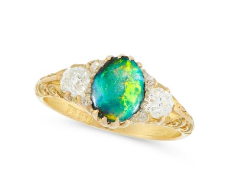 AN ANTIQUE BLACK OPAL AND DIAMOND DRESS RING in 18ct yellow gold, set with an oval cabochon black opal between two old cut di