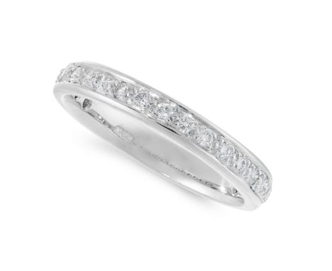 A DIAMOND ETERNITY RING in 18ct white gold, designed as a three quarter eternity, set with round cut diamonds, stamped 750, s