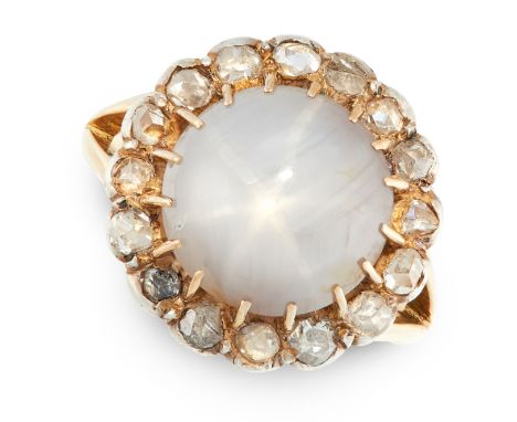 AN ANTIQUE STAR SAPPHIRE AND DIAMOND DRESS RING in 18ct yellow gold and silver, set with a round cabochon star sapphire of 9.