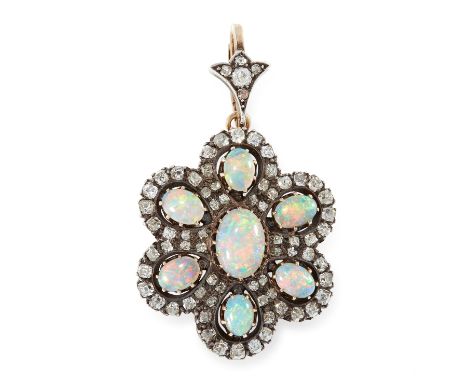 AN ANTIQUE OPAL AND DIAMOND PENDANT, LATE 19TH CENTURY in yellow gold and silver, designed as a flower, set with seven oval c