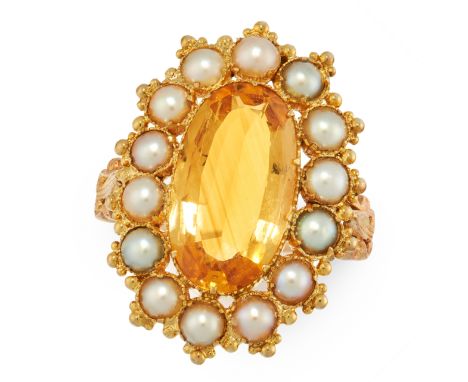 AN ANTIQUE IMPERIAL TOPAZ AND PEARL DRESS RING, 19TH CENTURY in yellow gold, set with an oval cut imperial topaz of 5.02 cara