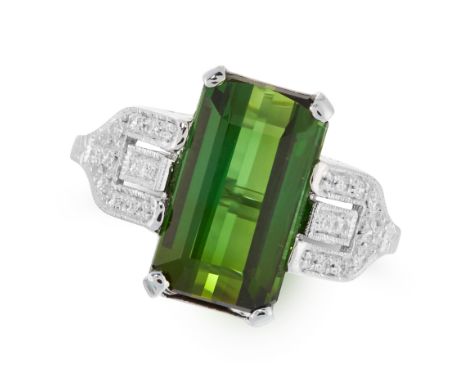 A GREEN TOURMALINE AND DIAMOND DRESS RING in 18ct white gold, set with a step cut green tourmaline of approximately 5.00 cara