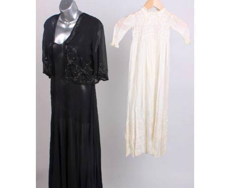 A 1920s black chiffon full length evening dress with chevron pattern stitched detail, a matching black chiffon jacket embelli