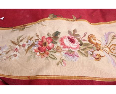 A collection of late 18th Century Aubusson rose design tapestry fragments from an abandoned chateau; a panel of blue and gold