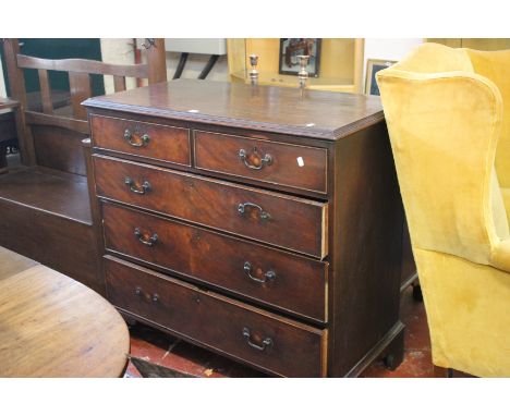 A George III mahogany chest with two short and three long drawers on bracket feet 