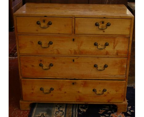 A Victorian pine chest with two short and three long drawers on bracket feet 