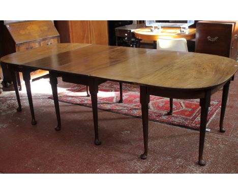 An 18th Century mahogany extending dining table on ring turned tapering legs and pad feet 71cm high, 260cm extended 