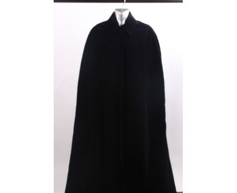 A 1970s Diorling by Christian Dior maxi length black velvet cloak, with a Harrods label