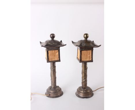 A pair of ‘Chinese’ silver-plated table lamps with moulded decoration of phoenix and dragons (2)H: 48cm