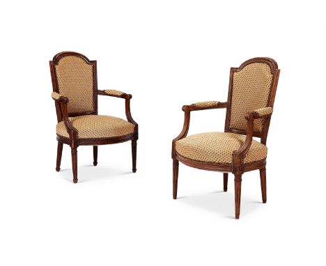 A MATCHED PAIR OF FRENCH WALNUT FAUTEUILS  19TH CENTURY  In green flower head needlework upholstery  87cm high, 57cm wide  To