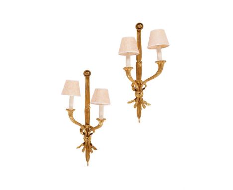 A PAIR OF FRENCH GILT METAL TWO BRANCH WALL LIGHTS  20TH CENTURY  With two cornucopia 'hung' from tied ribbons, both variousl