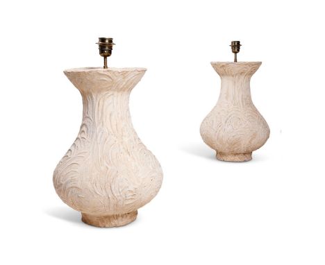 A PAIR OF MOULDED COMPOSITION STONE BALUSTER LAMP BASES  MODERN   The bodies with comb swirl pattern, continental fitting  57