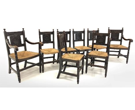  Set eight (6+2) early 20th century dark oak dining chairs, ball finials over floral carved back panels, string seats raised 