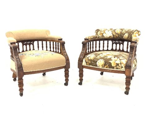 Pair late Victorian tub shaped armchairs, curved spindle gallery supporting upholstered backs, carved s scroll terminals with