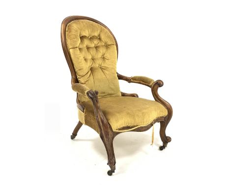 Victorian walnut framed open armchair with upholstered buttoned spoon back, carved frame with scrolled arm supports and cabri