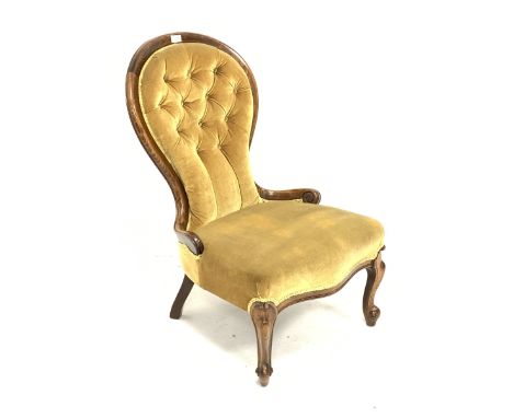 Victorian style stained beech framed spoon back nursing chair upholstered in buttoned pale green fabric, scroll carved cabrio