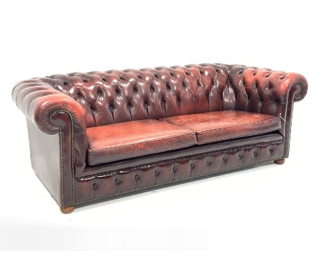 Late 20th century three seat chesterfield sofa upholstered in deeply buttoned red leather, W225cm, D98cm - Condition Report 