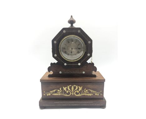 Regency period rosewood cased mantel clock, octagonal top with finial, silvered engine turned Roman dial, the base inlaid wit