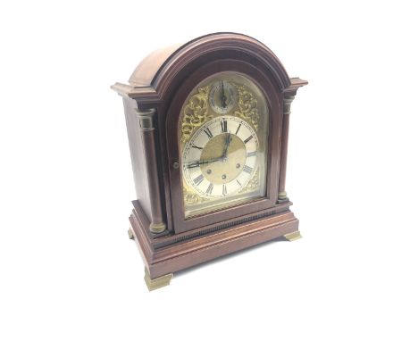 Early 20th century mahogany cased bracket clock, stepped arched pediment over domed bevel glazed door and turned pilasters, m