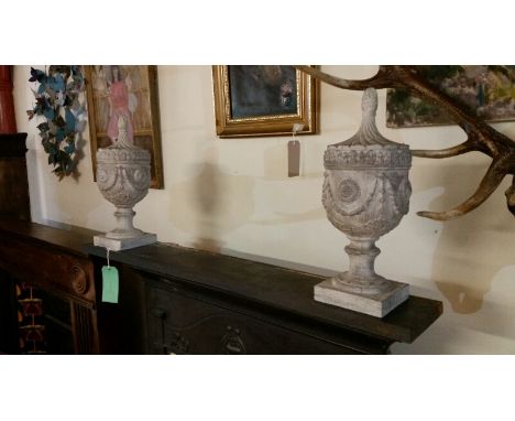 Pair of carved wood effect urns (resin) 44cm in limewash colour. They do not open, both one solid item