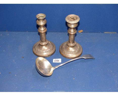 A Pair of plated extendable Candle holders (a/f.) stamped with a family crest and a silver plated ladle.