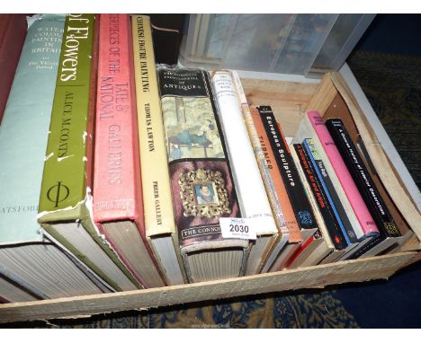 A wooden crate containing Antique reference books including World Furniture, Encyclopedia of Antiques, etc.