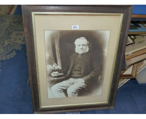 A large wooden framed print taken from a photograph of a seated gentleman, from The Vandyke Studio, Reading, 30 1/2'' x 24''.