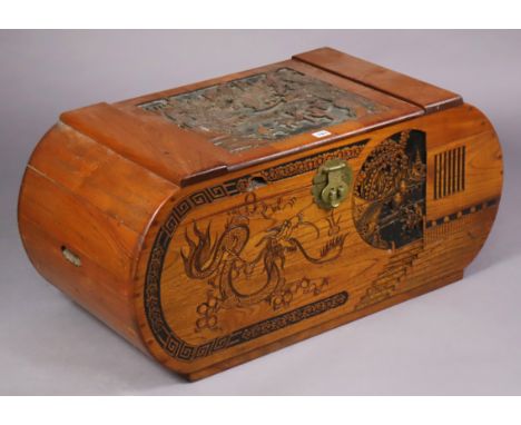 A Chinese carved camphor wood trunk with figure scene decoration to the hinged lift-lid &amp; front, 90cm wide x 41.5cm high 