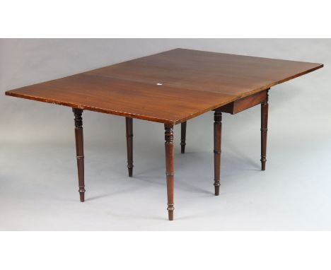 A 19th century mahogany drop-leaf dining table on six ring-turned tapered legs, 122cm wide x 73cm high. 